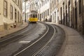 Classic traditional yellow trolley tram 28 in the streets of Lisbon