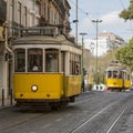 3 Classic traditional yellow trolley trams 28 in Lisbon, Portugal.