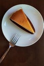 Classic triangle New york cheese cake on circle white plate sweet dessert