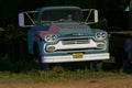 Old blue and pink abandoned truck on a summer night Royalty Free Stock Photo