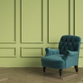 Classic Tufted armchair emerald color standing in classic interior. Green walls with mouldings,floor parquet oak Herringbon