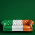 Classic tufted leather sofa in color of Irish flag on green background with copy space