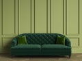 Classic tufted sofa in emerald green color in classic interior