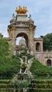 This classic two-tiered fountain and monument with an arch and a statue of Venus in the middle of it