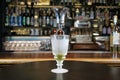 Classic type of absinthe preparation with brouiller on bar counter background. Royalty Free Stock Photo