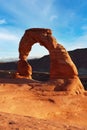 Classic vertical postcard with views of the famous Delicate Arch, Utah symbol and popular tourist attraction, in evening light at Royalty Free Stock Photo