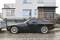 Classic veteran black old private sports car Porsche 944 Turbo Sport parked