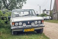 Classic veteran vintage historic Polish car Polski Fiat 125p front with logo and headlightswhite