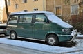 Old veteran big vintage VW Multivan V6 Transporter delivery van or camper parked in snow Royalty Free Stock Photo