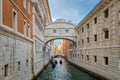Classic view of bridge of Sighs or Ponte dei Sospiri connecting Doge's palace to New prison, Venice, Italy. Few gondolas Royalty Free Stock Photo