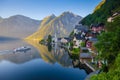 Classic view of Hallstatt with ship at sunrise, Salzkammergut, A