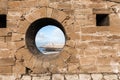 Classic view of medina Essaouira through a hole in the wall of t