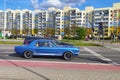 Classic vintage blue Ford Mustang coupe driving