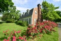 Classic vintage brick and siding house with dormers Royalty Free Stock Photo