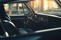 Classic vintage car interior with sunlit dashboard and steering wheel Royalty Free Stock Photo