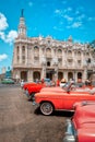 Classic vintage cars next to the beautiful Great Theater of Havana