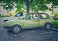 Classic vintage green VW Golf I parked