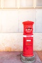 Classic vintage Japanese style postbox with cement wall background
