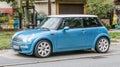 Old small blue car Mini Cooper parked left side view Royalty Free Stock Photo