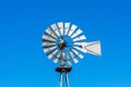 Classic vintage multi bladed wind pump, bladed rotor decorated with string lights