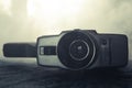 Classic vintage old 8mm movie camera on table with fog close up. Selective focus. Old Soviet Camera Royalty Free Stock Photo