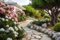 Classic and vintage pathway with green yard white rocks and flower bush