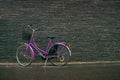 Classic Vintage Purple Hipster Bicycle on the Street