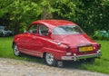 Classic vintage red Saab 96 two stroke motor parked