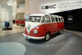 classic vintage red and white Volkswagen bus, automotive pop culture nostalgia 1960s, display Iconic show Volkswagen Group Forum