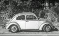 Classic vintage VW Beetle parked on side of a road Royalty Free Stock Photo