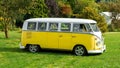 Classic vintage yellow Volkswagen Transporter camper van parked in the park, Devon, UK, August 26, 2017