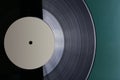 Classic vinyl record close-up on a green background, obsolete data storage, music Royalty Free Stock Photo