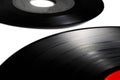Classic vinyl record, old black color on a white background and several discs, long play and single. Royalty Free Stock Photo
