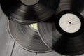 Classic vinyl records on gray wooden table