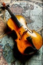 Classic violin on worldmap Royalty Free Stock Photo