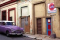 Classic vivid violet color car parked on the street