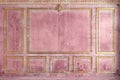 Classic wall of old gold stucco panels pink paint