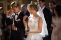 Classic wedding ceremony of stylish young luxury bride and groom