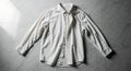 Classic White Button-Down Shirt on Marble Royalty Free Stock Photo
