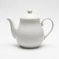 Classic White Ceramic Teapot with Lid and Handle on White Background porcelain Royalty Free Stock Photo