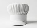 Classic white chef hat displayed on a flat surface with a subtle shadow effect isolated on white background Royalty Free Stock Photo