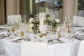 a table set with a table number, wine glasses and silverware Royalty Free Stock Photo