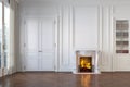 Classic white empty interior with fireplace, moldings, wall pannel, window, door.