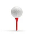 A classic white golf ball positioned atop a bright red tee marker for practice or display Royalty Free Stock Photo