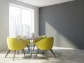 Yellow chair dining room interior, gray wall