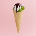 Classic white ice cream in crisp waffle cone with chocolate sauce, mint leaf on pink background, square, closeup. Royalty Free Stock Photo