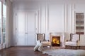 Classic white interior with fireplace, armchairs, carpet, moldings, wall pannel. Royalty Free Stock Photo