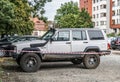 Classic white old 4WD Jeep Cherokee left side view