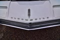 Classic white 1967 oldsmobile Toronado vintage car hood and emblem detail