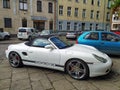 Classic white Porsche convertible sporting private car parked